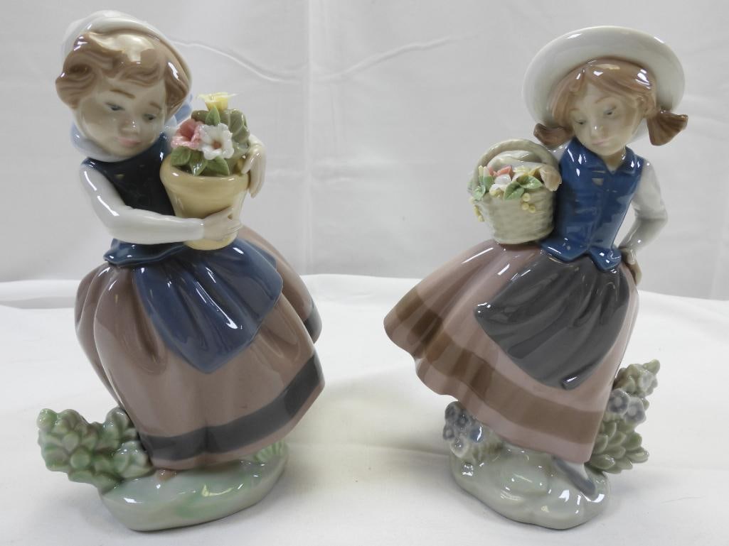 LOT OF 2 LLADRO Porcelain Girls Coordinating pair of Figurines: Lovely and detailed porcelain figurine PAIR of little girls with baskets of flowers in matching dresses, 1983, each approximately 6.5" tall ; made in Spain, the figurine showcases the beautiful and de