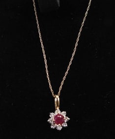 14kt Gold Ruby and Diamond Pendant necklace + single earring-------- 1.6 grams.