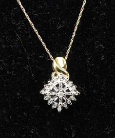 10KT yellow and white gold diamond cluster pendant necklace.