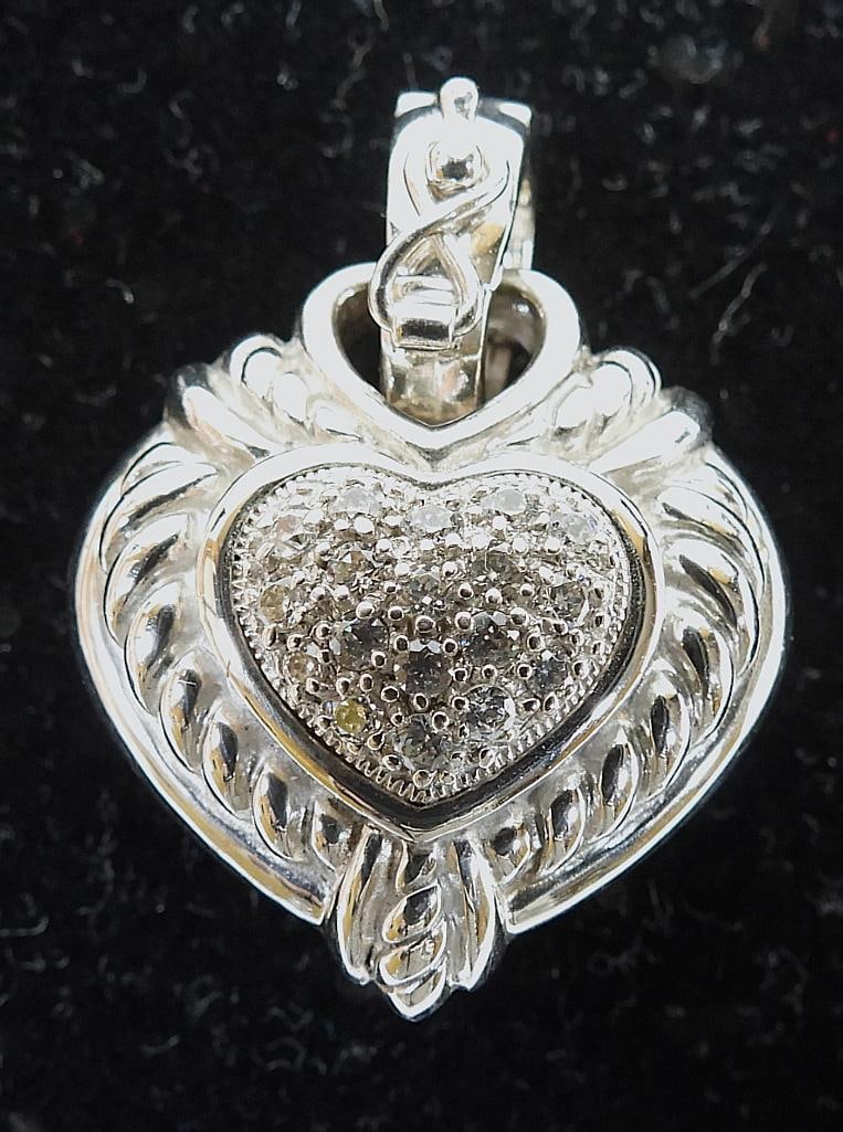 JUDITH RIPKA Sterling Silver and Crystal Heart pendant: JUDITH RIPKA sterling silver and crystal pave heart pendant approximately 0.75" wide x 1" long including bail