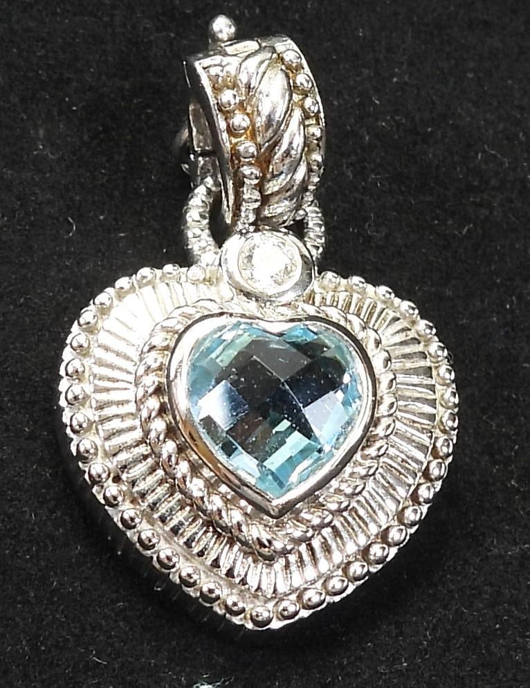 JUDITH RIPKA Sterling Silver and Blue topaz Heart Pendant: JUDITH RIPKA sterling silver and blue topaz heart pendant, approximately 0.75" wide x 1" long including bail