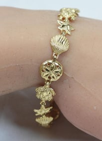 14kt gold Sea creatures, Seashells Star fish bracelet 7.5 grams