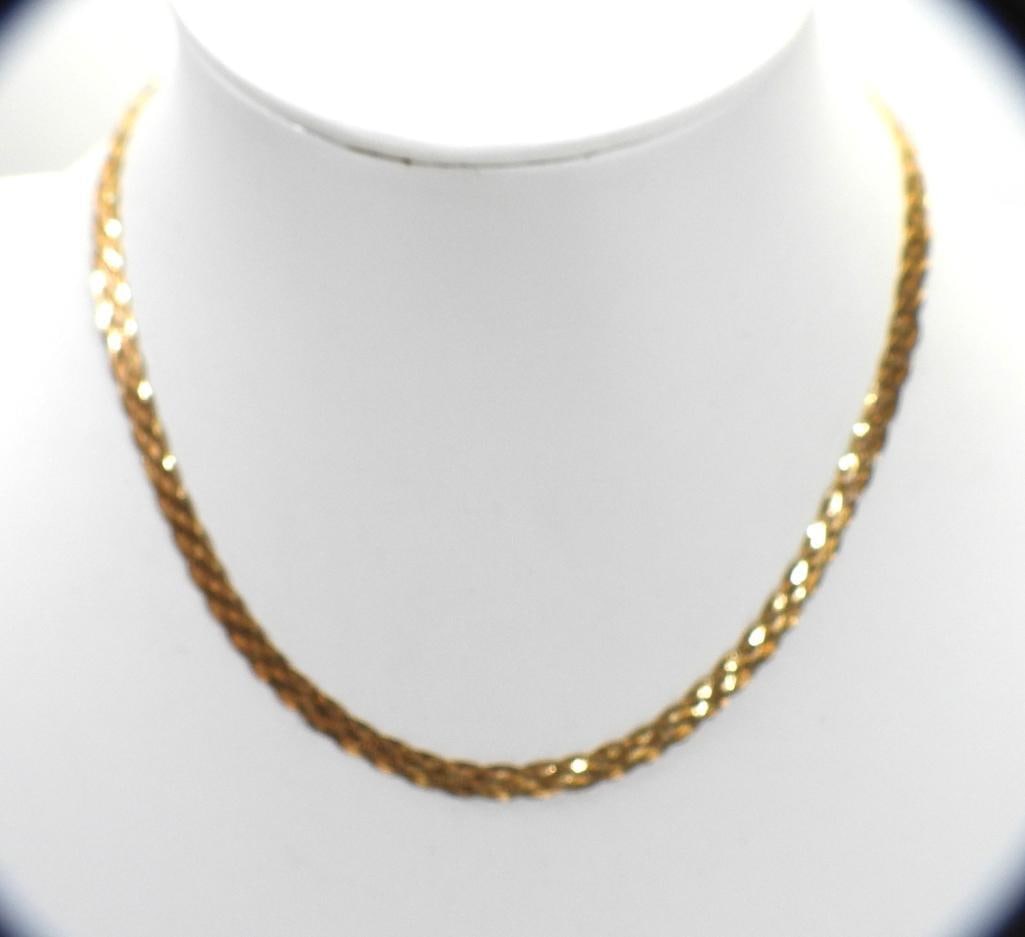 14kt gold 6 strand braided necklace chain 9.8 grams: Stunning 6 shimmering 14kt yellow gold braided strands terminating in a lobster slaps closure. Measures 16.5" long x 1/4" wide. Weighs 9.8 grams. Hallmarked 14kt gold.