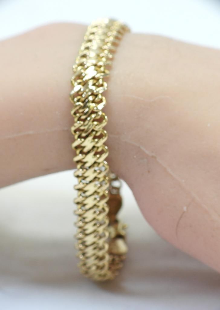 14kt gold wide elegant bracelet chain 7.6 grams 8" long: Lovely wide nearly 1/2" wide lovely ladies Hallmarked 14KT gold in yellow gold bracelet with a heavy clasp closure.