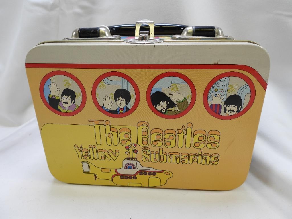 THE BEATLES Collectable Tin Tote by VANDOR WITH TAG: A Yellow Submarine collectable tin tote by VANDOR with groovy Beatles artwork in style "Porthole" marked 1999, approximately 5" x 7.25" x 3", WITH TAGS