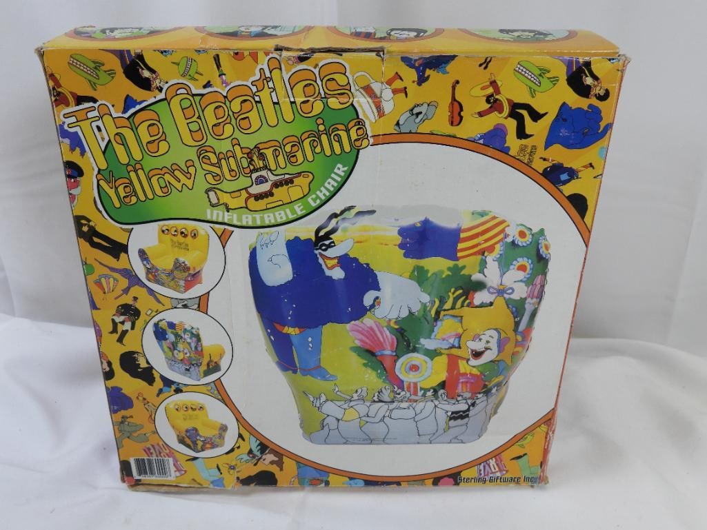 YELLOW SUBMARINE Inflatable Chair, BOXED: A Yellow Submarine-themed inflatable chair designed to hold up to 250 lbs by Sterling Giftware Inc. 1999