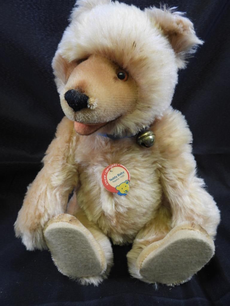 Vintage STEIFF 13" tall teddy baby replica 1930: Vintage STEIFF approx. 13" tall teddy baby replica 1930 with blue ribbon with bell and STEIFF ear button, moveable joints so can sit and stand freely, may have discoloration due to age, overall clean.