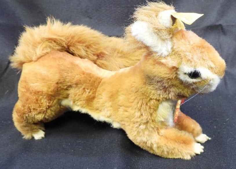 Vintage STEIFF 10" brown squirrel: Vintage STEIFF approx. 10" long brown squirrel with original tag and STEIFF ear button, may have discoloration due to age, overall clean.