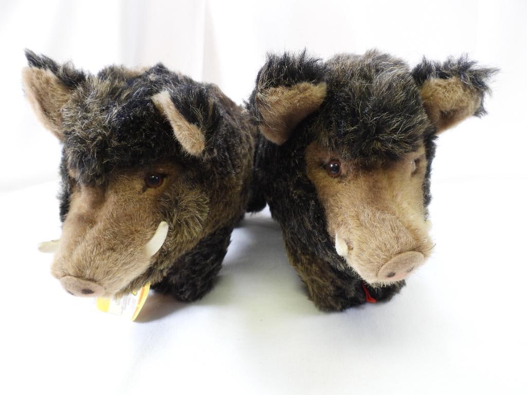 Vintage STEIFF pair of 11" long warthogs: Vintage STEIFF pair of approx. 11" long, 7" tall, 5" wide warthogs with STEIFF ear buttons, may have discoloration due to age, overall clean.