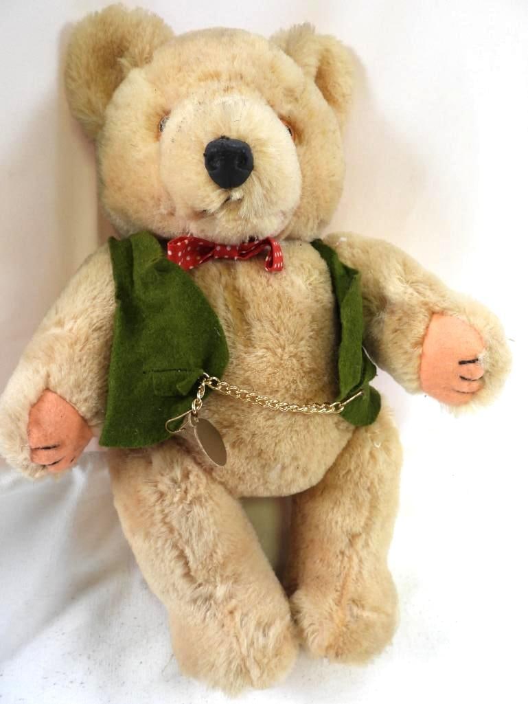 Vintage 12" teddy with green vest with chain: Vintage approx. 12" teddy with green vest with chain and red and white polka dot bow tie, moveable limbs so can stand and sit freely, may have discoloration due to age