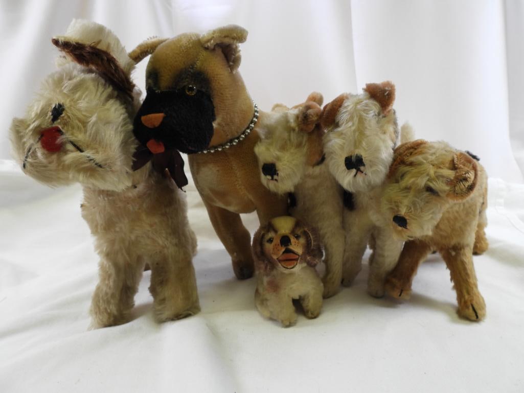 Vintage LOT OF 8 STEIFF and other dogs: Vintage LOT OF 8 STEIFF and other dogs, some with STEIFF ear buttons, may have discoloration and wear due to age, ranging approx. 5" to 11" tall