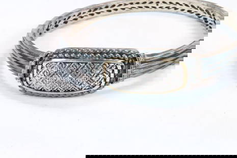 14kt gold Sterling silver diamond cuff bracelet 32.9 grams: Hallmarked 14K 925 AU. Blackened sterling silver with gold border with cross diamonds on a double locking hinged cuff. Some wear to the finish. Measures: 2-3/8" across x 3/4" at the widest on the top.