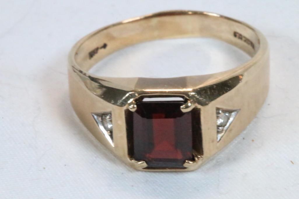 10Kt gold men's Amethyst and diamond ring 5.1 grams size 13: Hallmarked 10K with 9.5mm x 8mm amethyst with diamond chips on each side. Brushed gold top half with a seam and smooth gold underside.