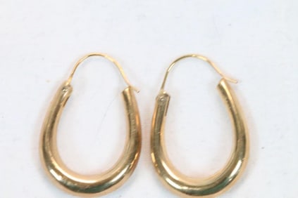 14kt gold oval hoop pierced earrings 1.3 grams