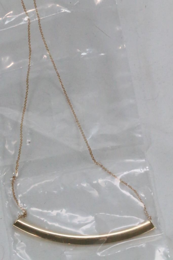 NEW 14kt Gold Italian Polished Smile necklace 2.5 grams: Brand new in the plastic bag with details imprinted about the necklace. Smile bar is 3" wide x approx. 6mm. Chain is approx. 16" long with 8" center drop.