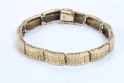 14kt gold heavy Aztec design embossed link bracelet 25.5 grams 7" long.