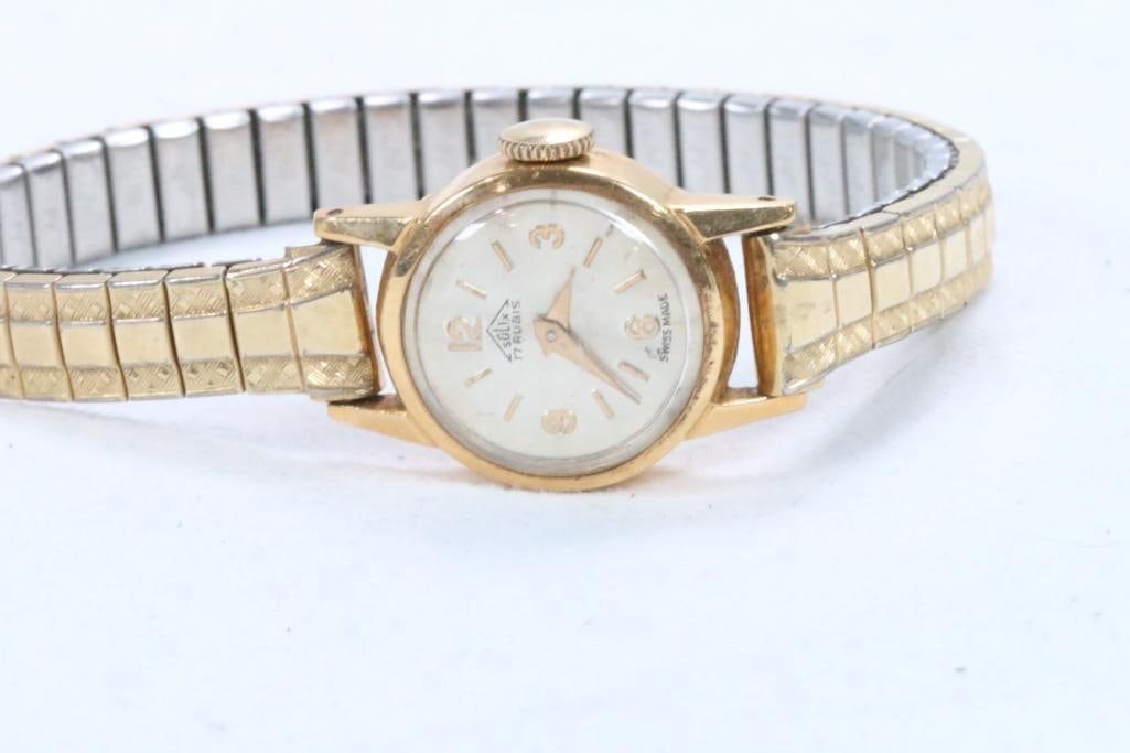 18 kt gold Solix 17 Rubis Swiss Watch.: Hallmarked: 18Kt 0750 on the Gold watch case. 1/30 10KGRP Gold plate caps over Speidel band. 1/50 10KGRP ctr and ends