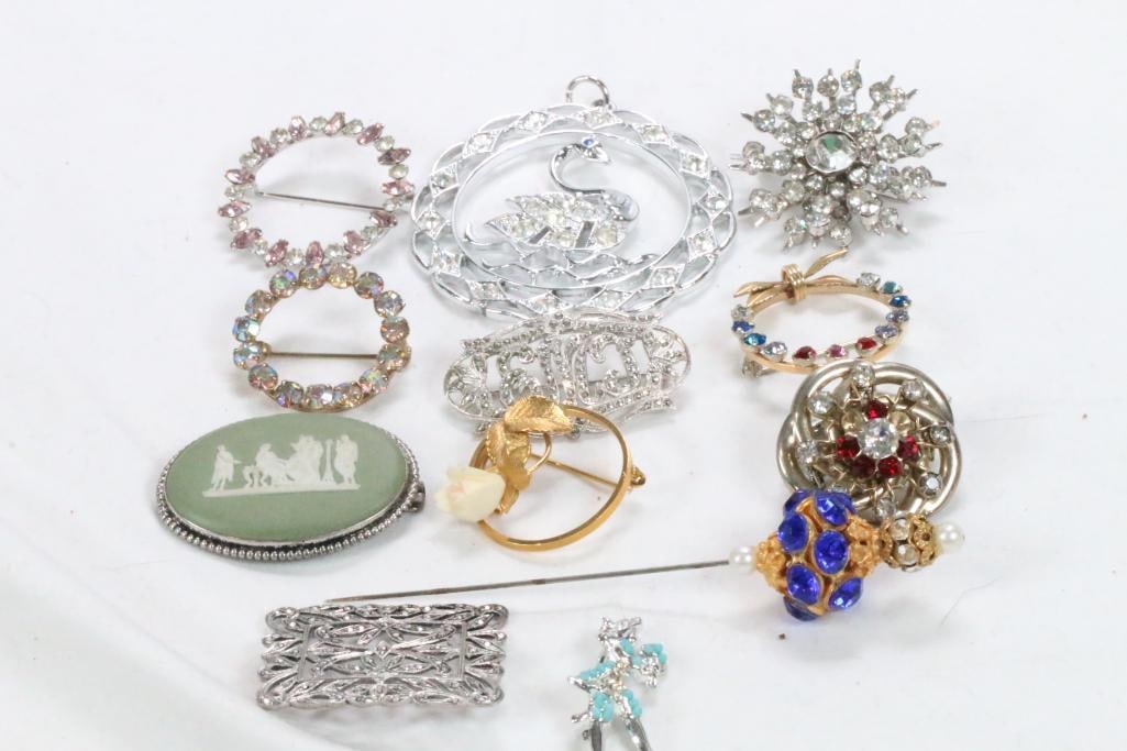 Vintage Lot of 13 brooches with pendant: Includes Victorian design Hat Stick pin with blue& clear stones, 12 vintage, antique brooches (1 is green wedgwood jasperware cameo)and a large swan pendant
