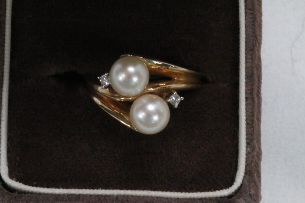 14KT gold cultured pearl and sapphire ring 5.5 grams. Size: 7.25: 2 Beautiful luster large 6.5mm pearls with 2 small sapphires (1 each side).