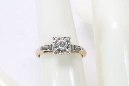 14Kt Yellow and white Gold Diamond solitaire ring with baguette sides 2.4 grams. Size 6.