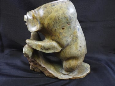 Large solid Stone bear figure at rock