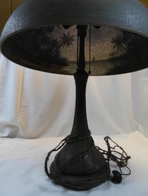 Antique reverse paint glass shade and cast metal base