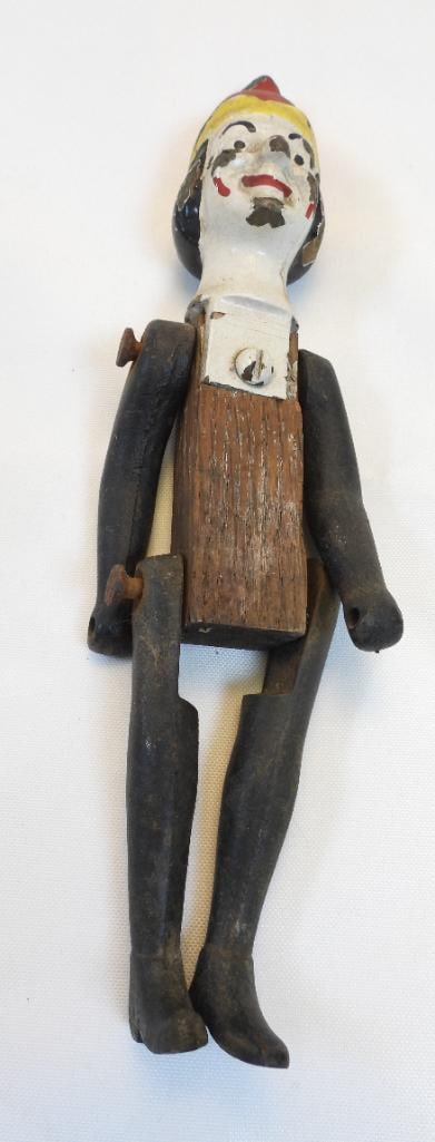 Antique cast-iron/wood clown moveable limbs clown: vintage cast-iron/wood clown, approx. 8.5" tall, painted but paint is wearing off (see photos) due to age
