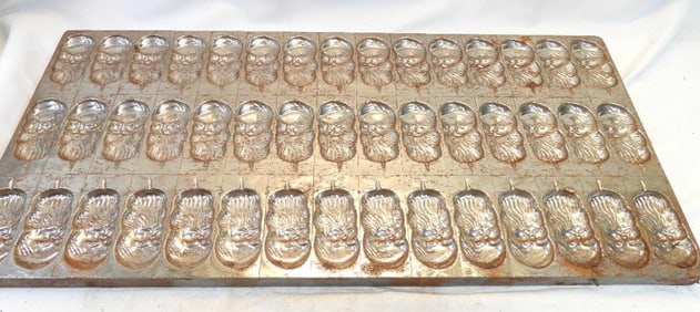 Antique chocolate mold with Santas