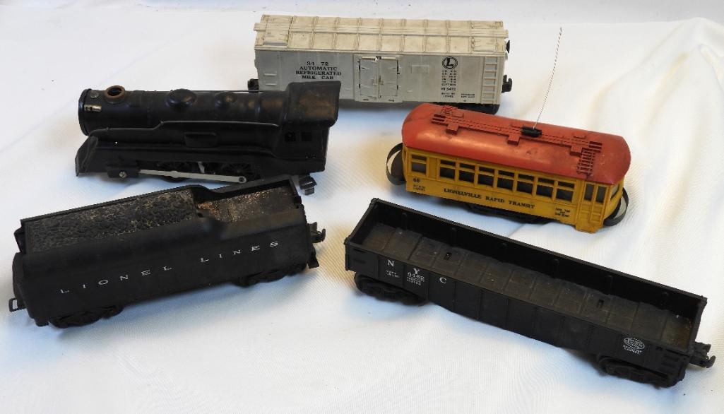 Vintage LOT OF 5 LIONEL train cars: LOT OF 5 LIONEL train cars, ranging in length from approx. 7" to 9.75" long