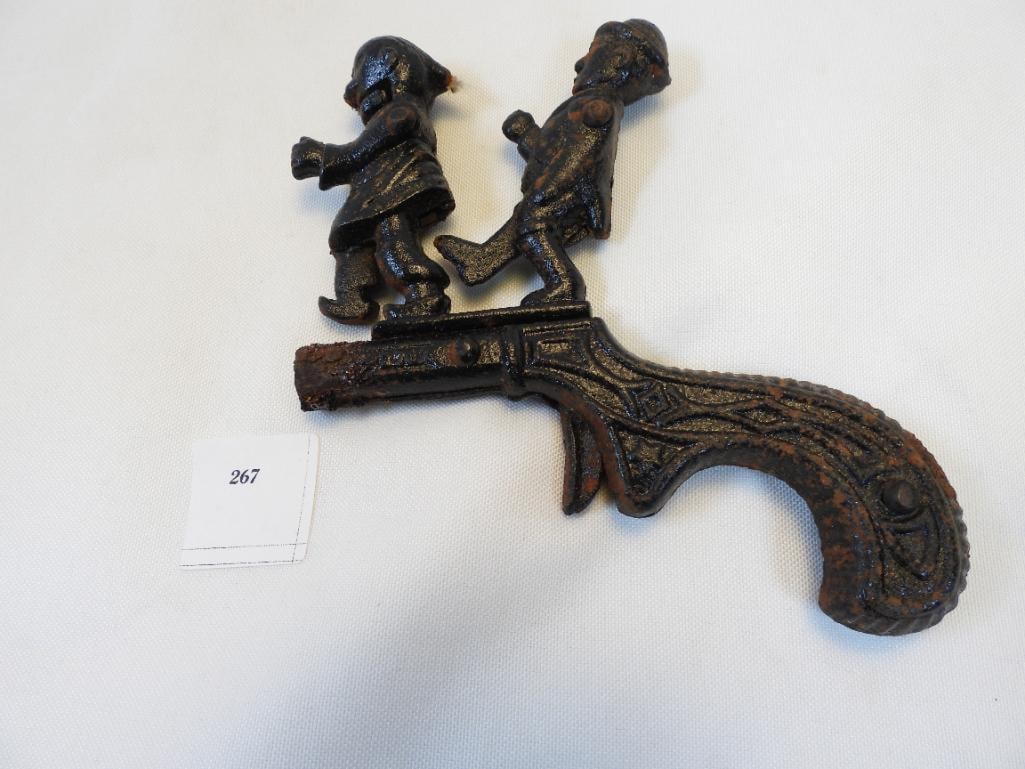 Antique Cast Iron Chinaman Must Go Cap Gun: Chinese Must Go Cap Gun, pulling trigger makes man kick Chinaman so originally would have exploded cap that's placed in his mouth), approx. 4"x5", see photos for each part