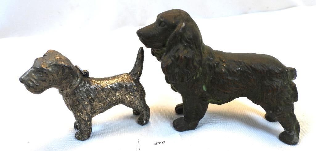 Antique LOT OF 2 cast metal dog figurines: LOT OF 2 metal dog figurines including Scottish Terrier, approx. 2" tall and Cocker Spaniel approx. 3" tall