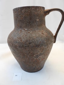 Antique heavy rustic primitive cast iron pitcher vase