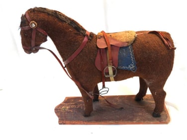 Antique German toy horse on wood base, likely from early 20th century