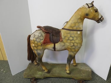 Large antique decorative wooden horse pull toy on wheels