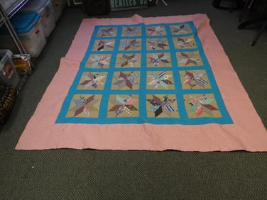 Antique light pink handmade quilt with colorful star-pattern design