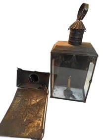 Antique punched-tin lantern and parts of another lantern