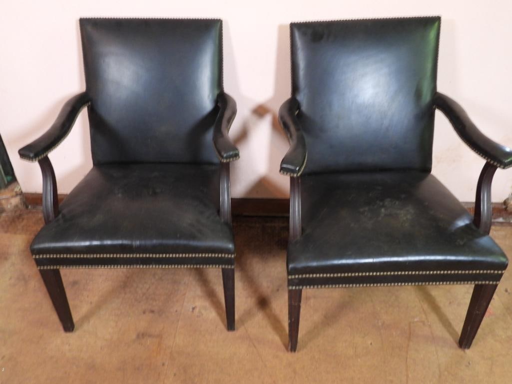 Vintage Saybolt Cleland Black Leather side chairs: Each has the manufacturer on the undersid brass plate. Brass tack. Wood legs. 24.5" w x 21.5" d x 37.5" h