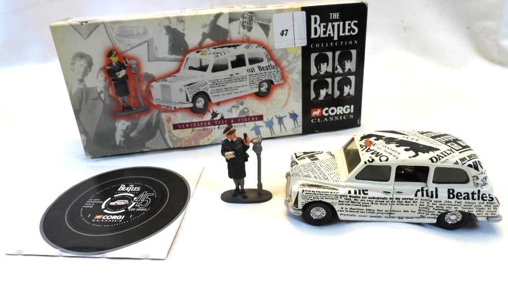 Corgi 58003 BEATLES NEWSPAPER TAXI and figure in box: Corgi 58003 BEATLES NEWSPAPER TAXI and figure in box, taxi is approx. 2" tall, 5" long and 2" wide and figure is approx. 1.5" long and 2" tall