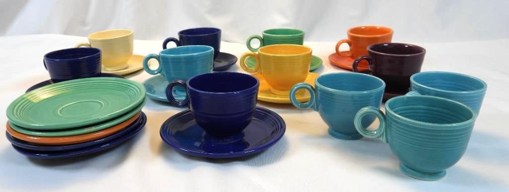 LOT of FIESTA WARE 12 TEA CUPS and 14 SAUCERS: LOT of FIESTA WARE 12 TEA CUPS and 14 SAUCERS in variety of colors including navy, light teal, yellow, orange, and navy