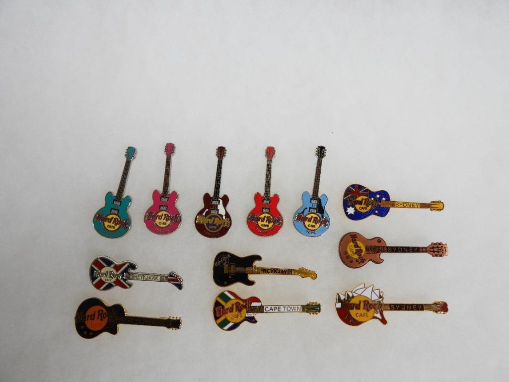 LOT OF 12 Hard Rock Café pins including Reykjavik and Cape town: LOT OF 12 Hard Rock Café pins including Reykjavik and Cape town. See photos for designs and markings including CSJTK, G322Y, BKWCY, G9RPB