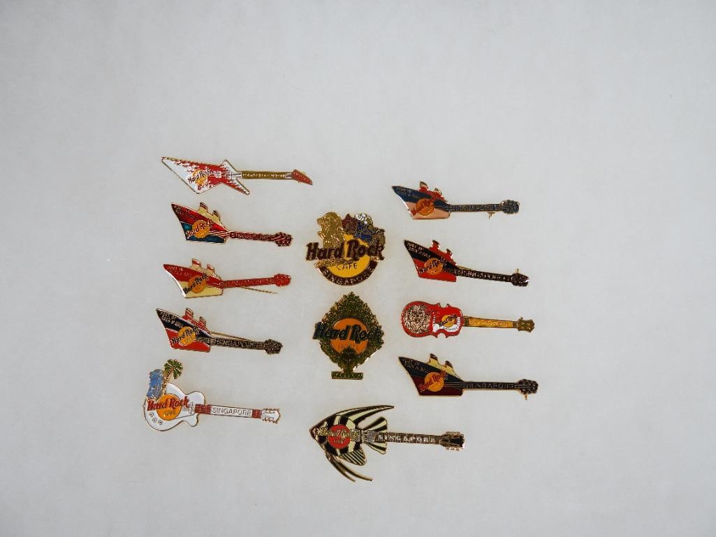 LOT OF 12 Hard Rock Café pins including Pattaya and Singapore: LOT OF 12 Hard Rock Café pins including Pattaya and Singapore (see photos for designs).