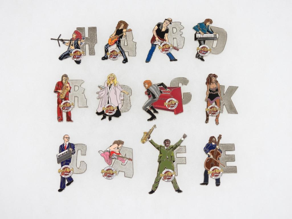 LOT OF 12 Hard Rock Café pins that spell out Hard Rock Café: LOT OF 12 Hard Rock Café pins that spell out Hard Rock Café with letters with different performers (see photos for designs)