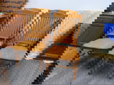 Set of 4 solid oak chairs, one is an arm chair