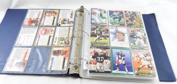 Large binder of football, baseball and basketball cards