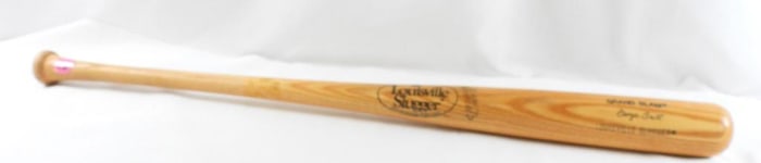 Louisville slugger Grand Slam wooden baseball bat with engraved signature of George Brett