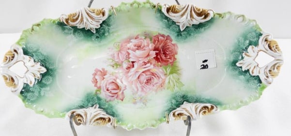 Antique RS Prussia porcelain celery or relish dish with a roses motif with handled ends