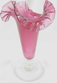 Vintage cranberry glass vase with a ruffle rim and spiral optic pattern