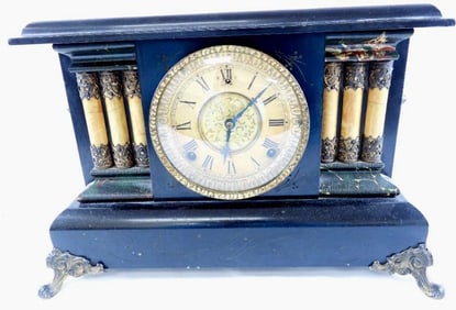 Antique black marble mantel clock, likely from late 19th century/early 20th century