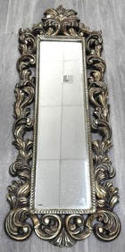 Antique-style, Baroque-inspired carved wall mirror