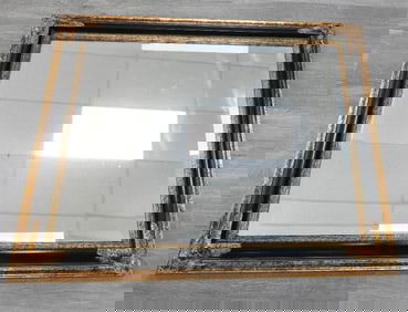 Decorative rectangular wall mirror with black and gold-toned frame